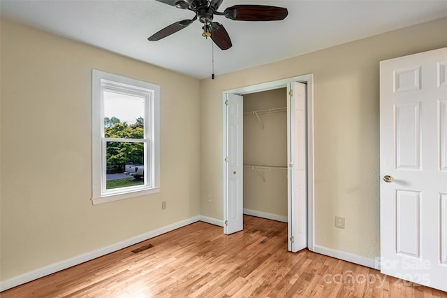 110 Maplewood Knoll Dr, East Flat Rock, NC 28726 - unfurnished bedroom with a closet, light wood finished floors, baseboards, visible vents, and a ceiling fan