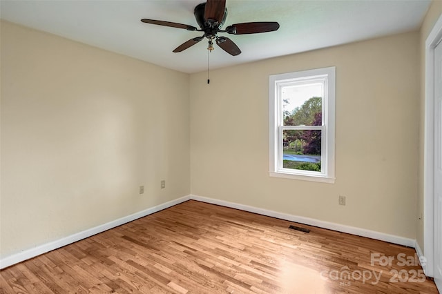 110 Maplewood Knoll Dr, East Flat Rock, NC 28726 - empty room featuring a ceiling fan, visible vents, wood finished floors, and baseboards