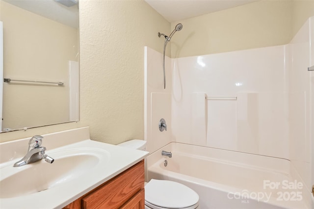 110 Maplewood Knoll Dr, East Flat Rock, NC 28726 - full bathroom with a textured wall, toilet, vanity, and bathing tub / shower combination