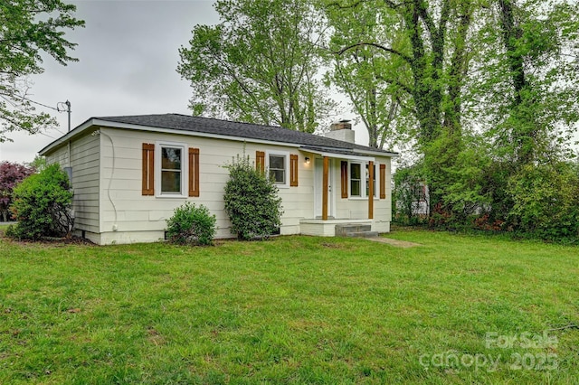 110 Maplewood Knoll Dr, East Flat Rock, NC 28726 - view of front of home with a front yard and a chimney