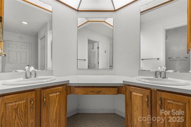 bathroom with a sink and two vanities