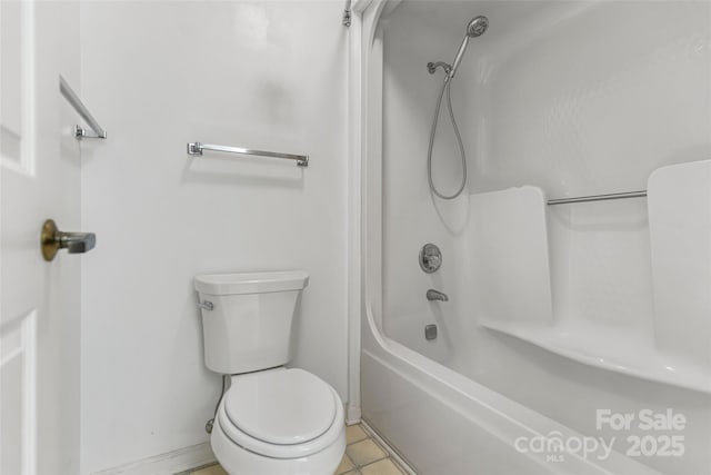 bathroom with tile patterned floors and toilet