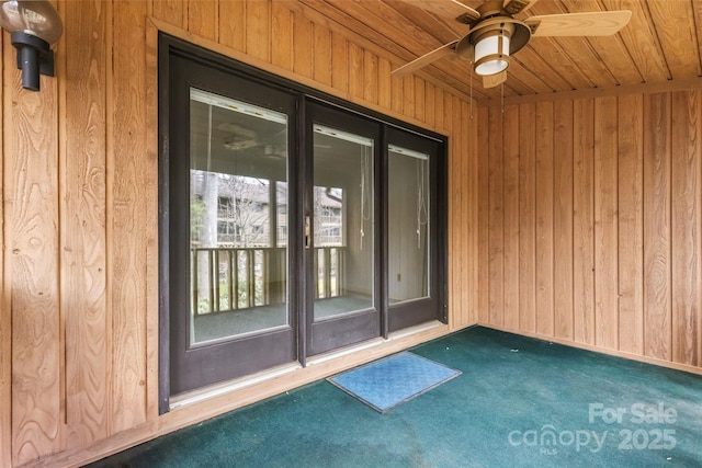 doorway to property featuring a ceiling fan