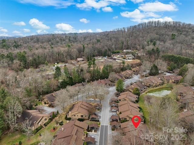 aerial view with a forest view and a residential view