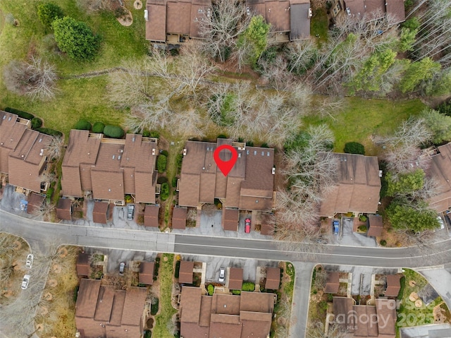 birds eye view of property with a residential view