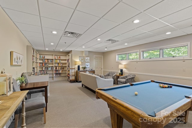 game room featuring a wealth of natural light, visible vents, and carpet