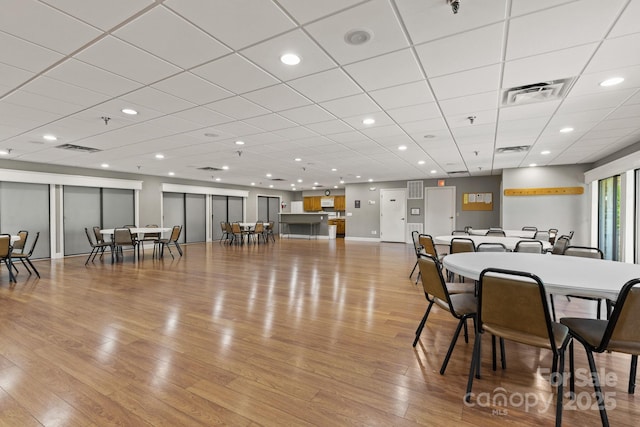 dining room with recessed lighting, visible vents, light wood-style flooring, and a paneled ceiling