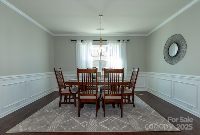 246 Sweet Briar Dr, Fort Mill, SC 29707 - dining room featuring visible vents, ornamental molding, wainscoting, a notable chandelier, and dark wood-style flooring