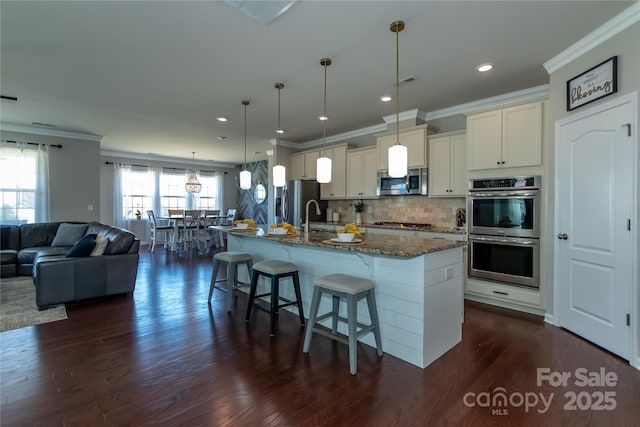 246 Sweet Briar Dr, Fort Mill, SC 29707 - kitchen featuring dark stone countertops, dark wood-type flooring, appliances with stainless steel finishes, a kitchen bar, and open floor plan