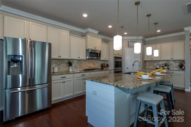 246 Sweet Briar Dr, Fort Mill, SC 29707 - kitchen featuring dark wood finished floors, decorative light fixtures, dark stone counters, stainless steel appliances, and a sink