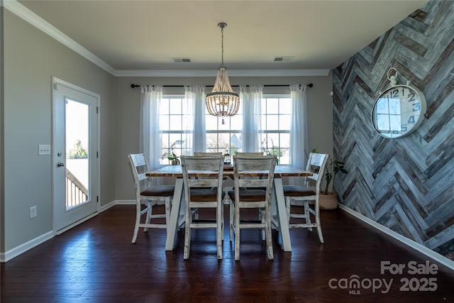 246 Sweet Briar Dr, Fort Mill, SC 29707 - unfurnished dining area with a notable chandelier, dark wood-style floors, visible vents, and ornamental molding