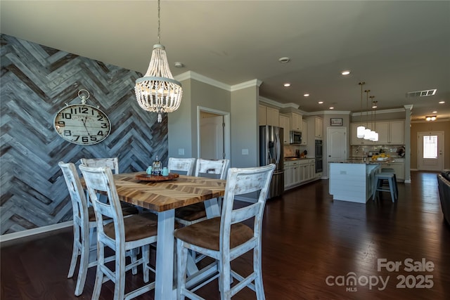 246 Sweet Briar Dr, Fort Mill, SC 29707 - dining space with visible vents, dark wood-type flooring, an accent wall, recessed lighting, and an inviting chandelier