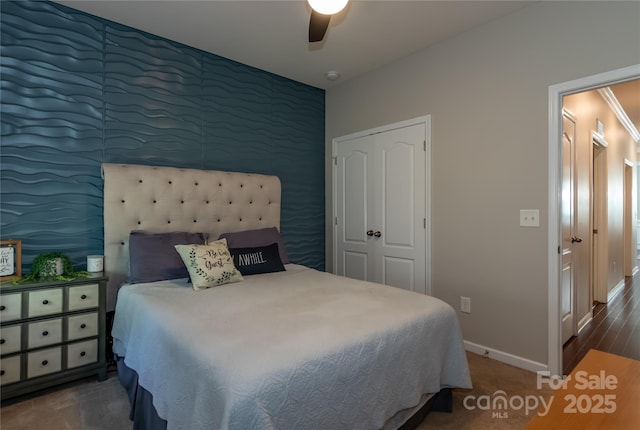 246 Sweet Briar Dr, Fort Mill, SC 29707 - bedroom featuring ceiling fan, an accent wall, baseboards, and wood finished floors