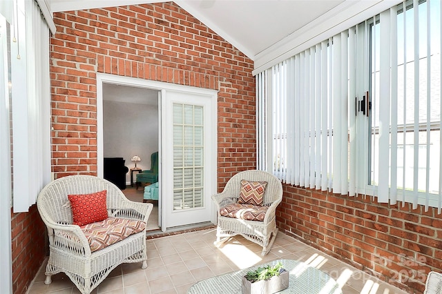 sunroom / solarium featuring vaulted ceiling