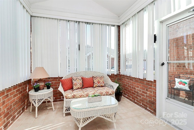 sunroom featuring lofted ceiling