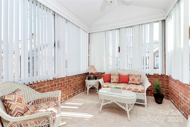 sunroom with vaulted ceiling and ceiling fan