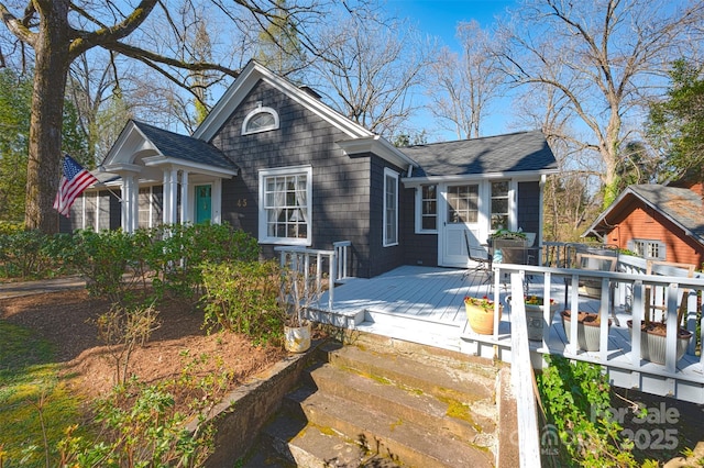 view of front of home featuring a wooden deck