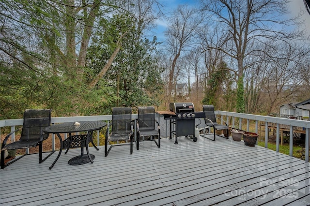 wooden terrace featuring grilling area