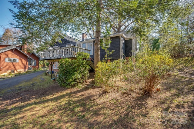 view of yard with a wooden deck