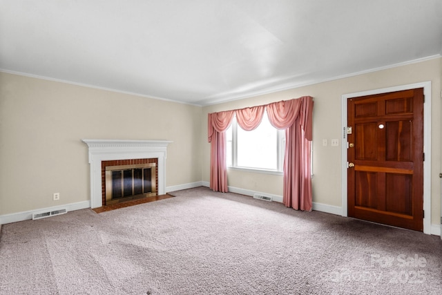 unfurnished living room featuring carpet flooring, a fireplace, visible vents, and baseboards