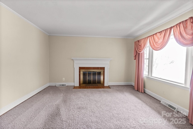 unfurnished living room featuring baseboards, visible vents, carpet flooring, and a brick fireplace
