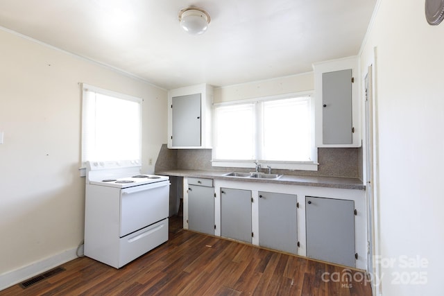 kitchen with dark wood-style floors, visible vents, a sink, decorative backsplash, and electric stove