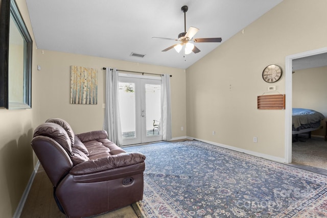 carpeted living room featuring visible vents, baseboards, ceiling fan, vaulted ceiling, and french doors