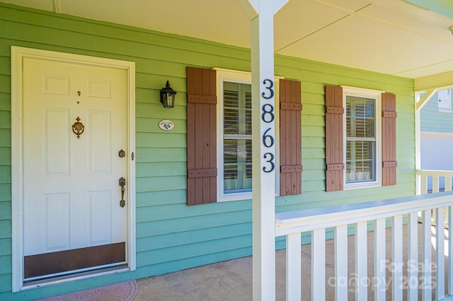 entrance to property with covered porch