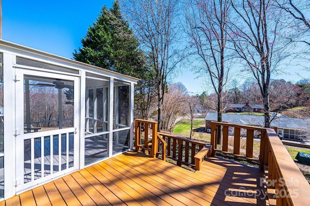 deck with a sunroom