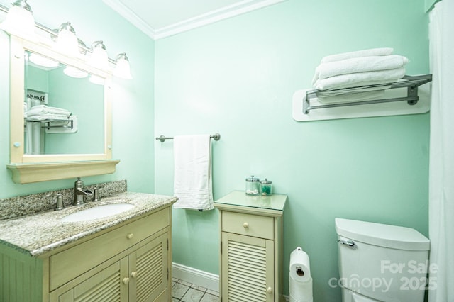 bathroom featuring toilet, marble finish floor, crown molding, baseboards, and vanity