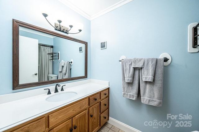 full bathroom with tile patterned flooring, crown molding, baseboards, toilet, and vanity