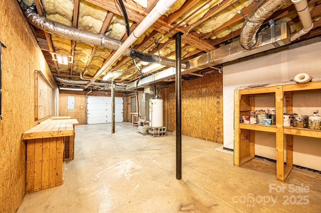 unfinished basement featuring gas water heater