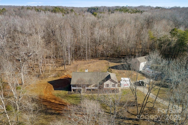 aerial view with a wooded view