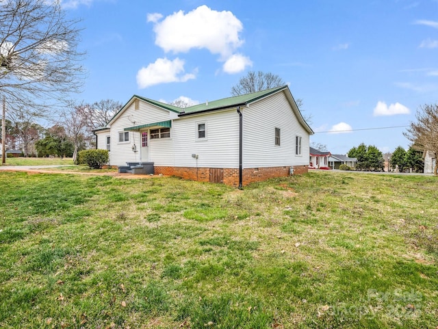 rear view of house with a lawn