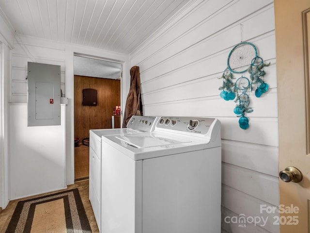 laundry area with electric panel, laundry area, and washing machine and clothes dryer