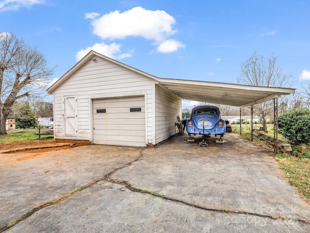 garage featuring driveway and a garage