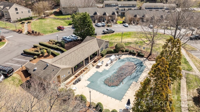 birds eye view of property with a residential view