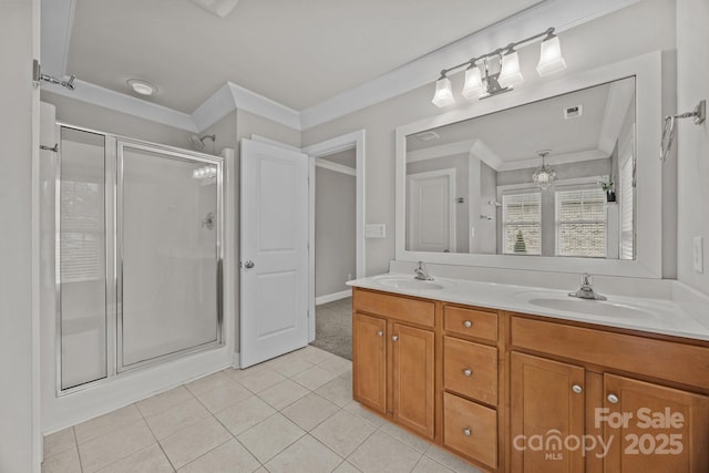 full bath with a shower stall, double vanity, tile patterned floors, and a sink