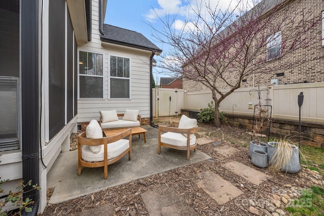 view of patio / terrace featuring an outdoor living space and a fenced backyard