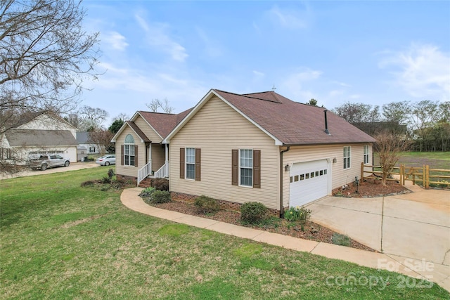 ranch-style house featuring an attached garage, a front lawn, roof with shingles, and concrete driveway