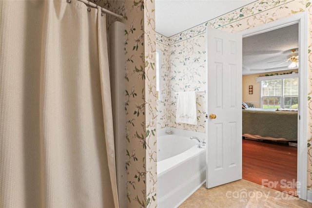 bathroom featuring connected bathroom, a garden tub, and wallpapered walls