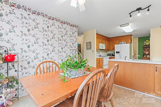 dining room with light tile patterned floors and a ceiling fan