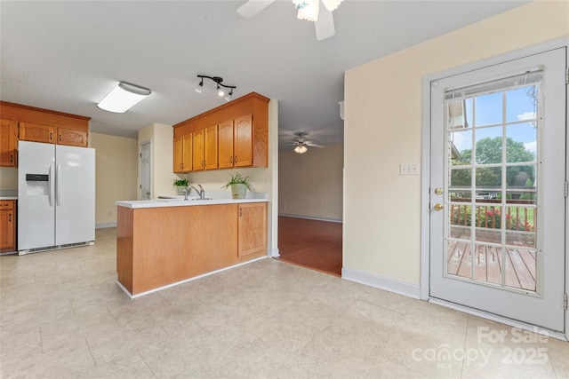 1278 Gracebrook Dr, Salisbury, NC 28147 - kitchen featuring white refrigerator with ice dispenser, a ceiling fan, a peninsula, and light countertops