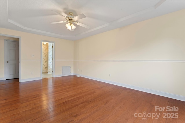 1278 Gracebrook Dr, Salisbury, NC 28147 - spare room featuring a raised ceiling, a ceiling fan, and wood finished floors