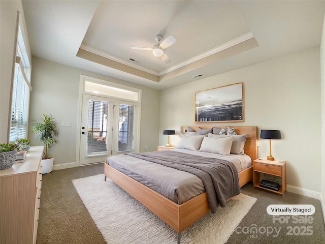 bedroom featuring visible vents, baseboards, carpet flooring, a raised ceiling, and access to exterior