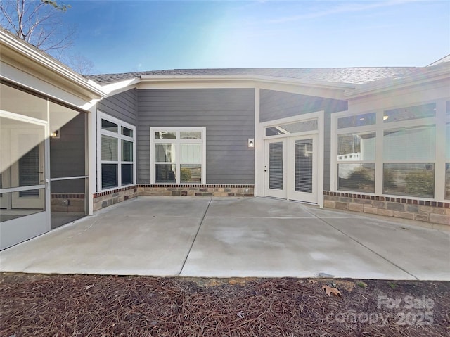 view of patio with a sunroom