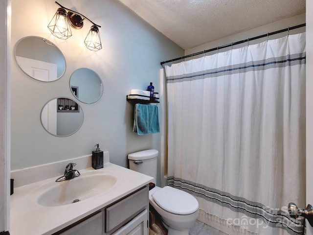 bathroom featuring toilet, curtained shower, a textured ceiling, and vanity