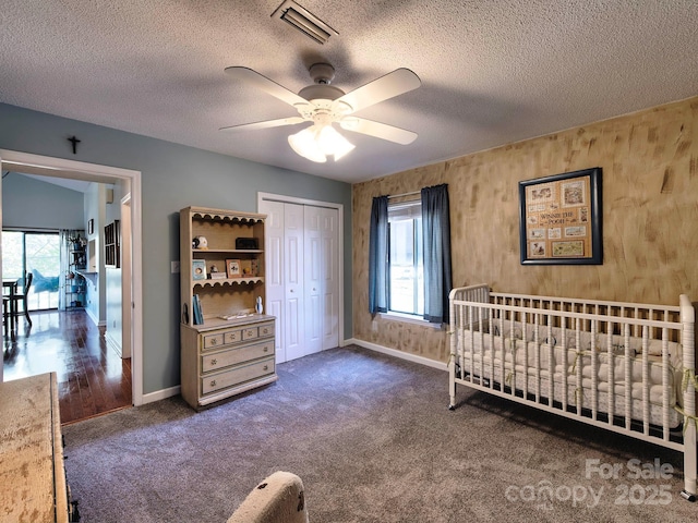 bedroom featuring a closet, multiple windows, carpet, and visible vents