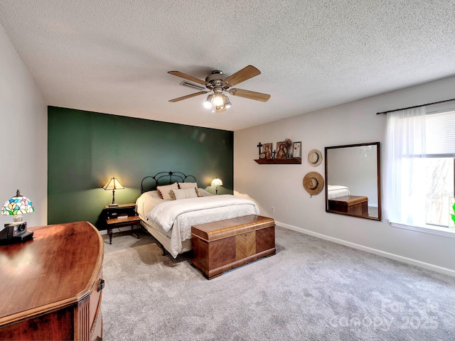 bedroom with baseboards, carpet floors, and ceiling fan