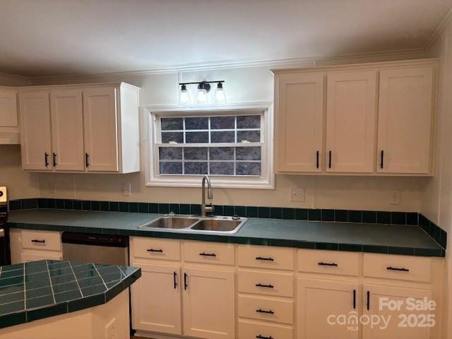 kitchen featuring tile countertops, white cabinets, stainless steel dishwasher, and a sink